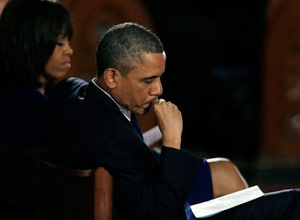 El presidente Barack Obama y su esposa Michelle, durante el servicio religioso celebrado el jueves en Boston.